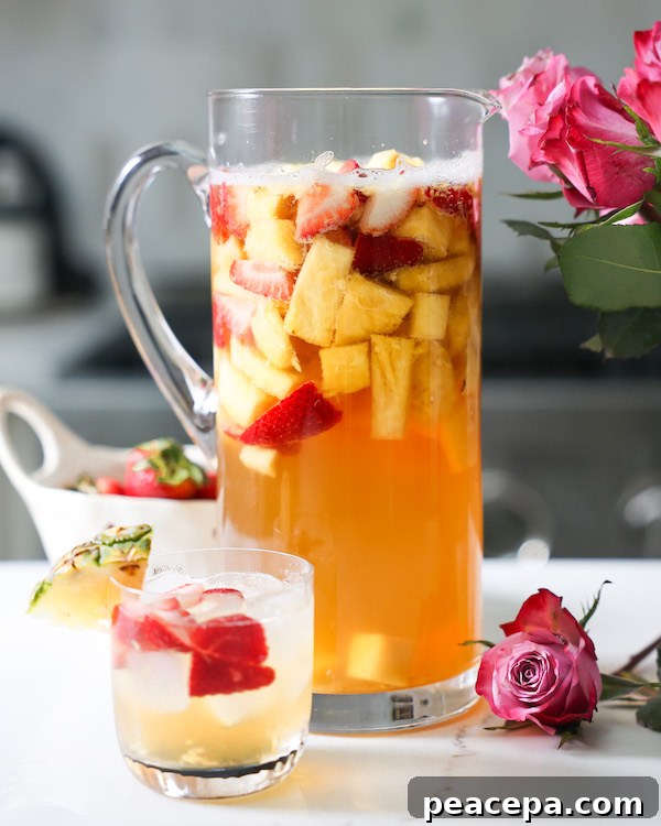 Pineapple White Wine sangria in pitcher and glass