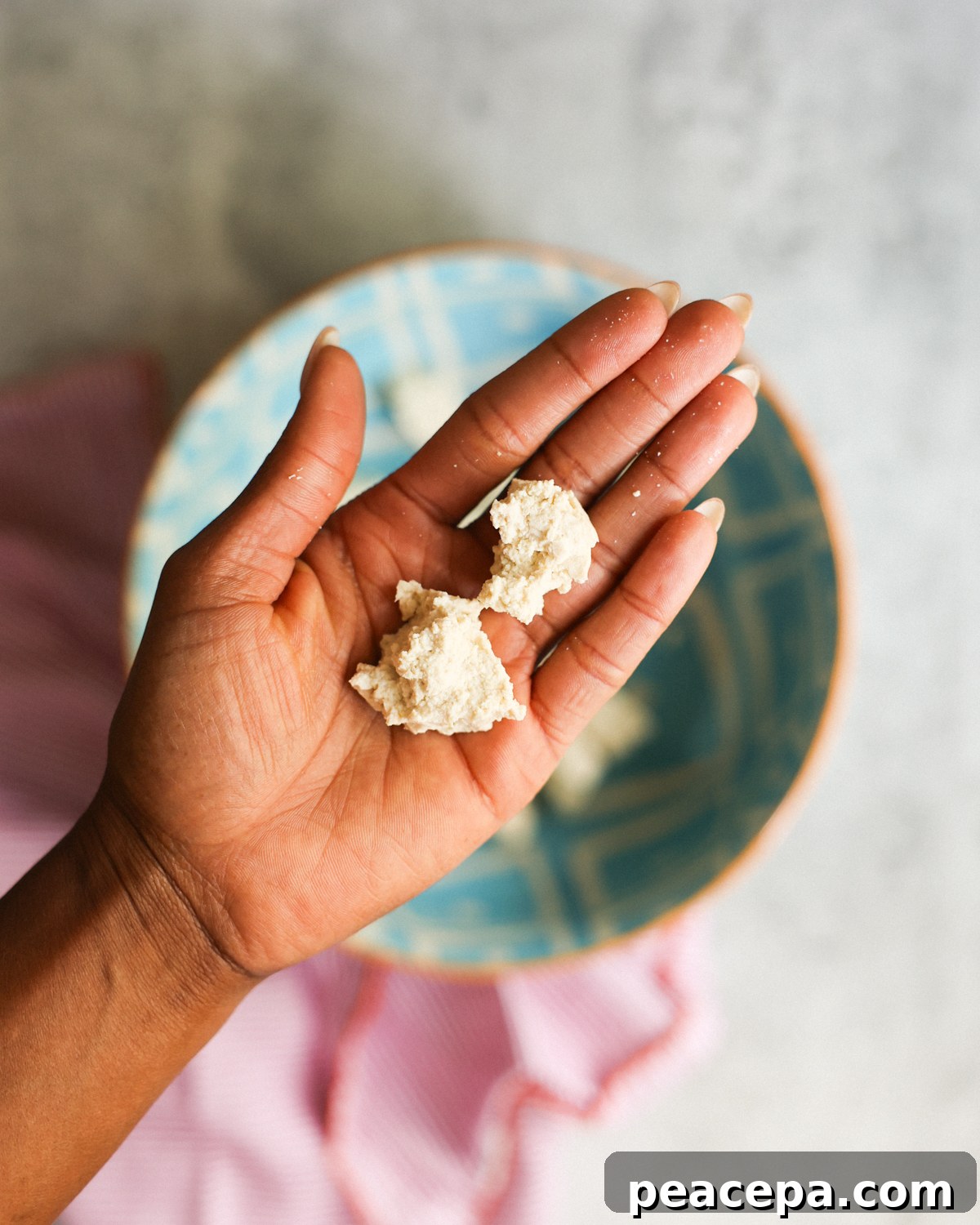 tofu chunks in hand
