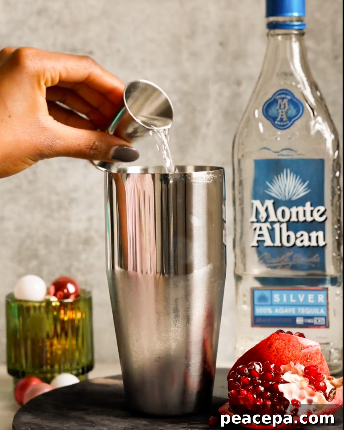 adding tequila to cocktail shaker