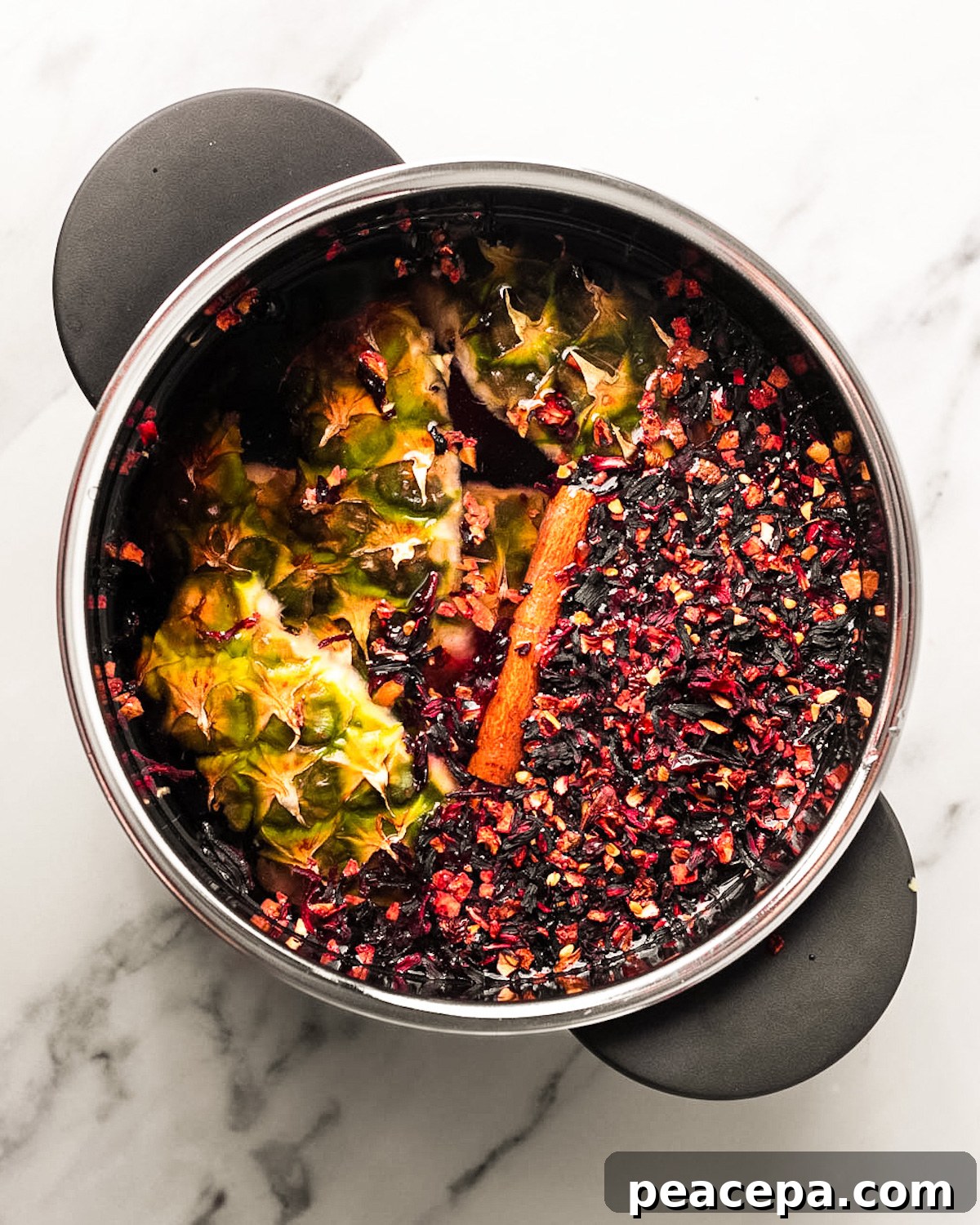 pineapple peels and hibiscus in pot