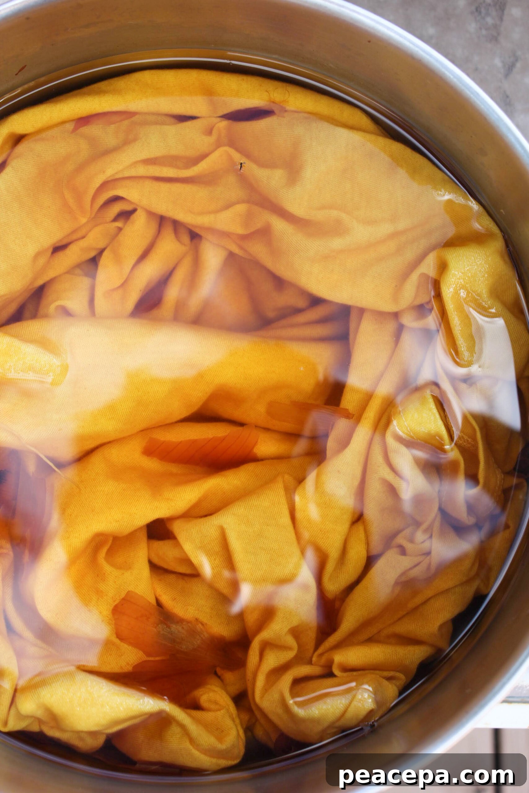 Onion skins turning water yellow.