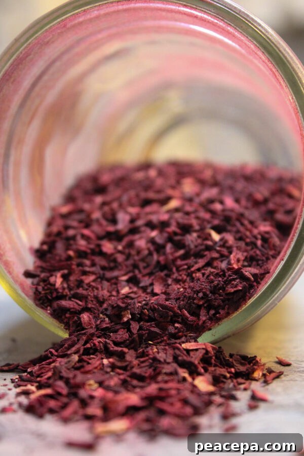 Dried hibiscus spilling out of jar