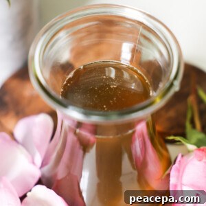 homemade closeup of Rose simple syrup in a jar
