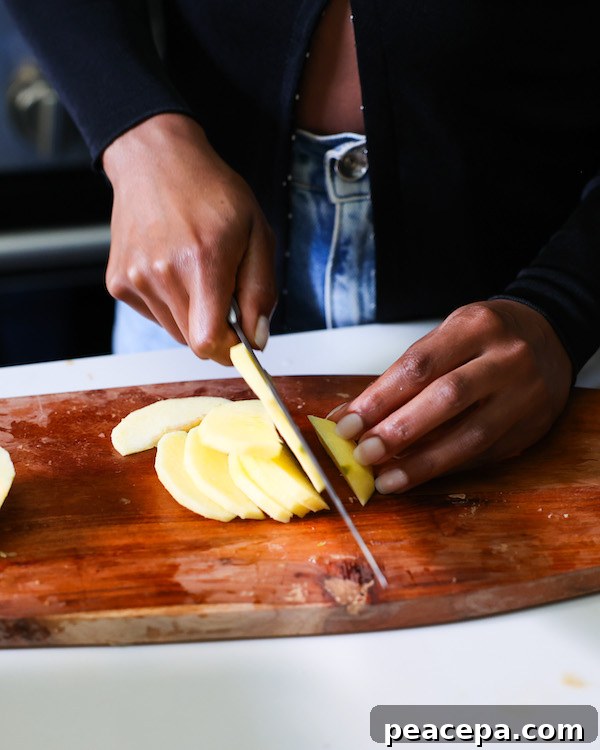 Slicing apples for apple pie.