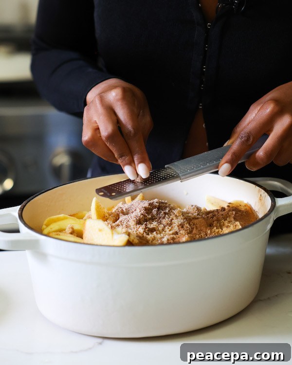 Nutmeg being grated into pot.