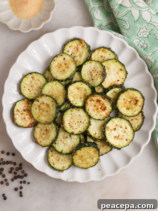 A plate of air fried zucchini on the coutner.