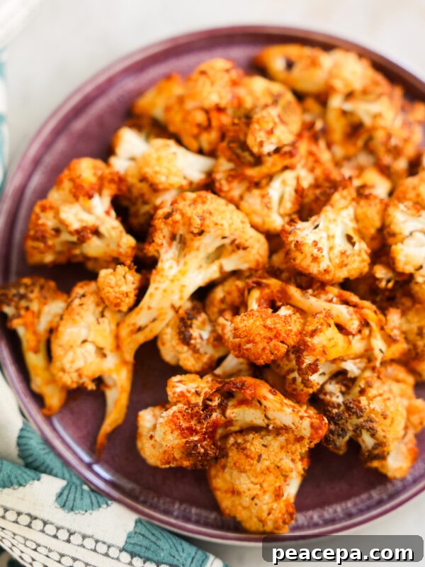 close up of air fryer cauliflower on a purple plate