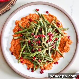 Air fryer green beasn and muhammara on a plate.