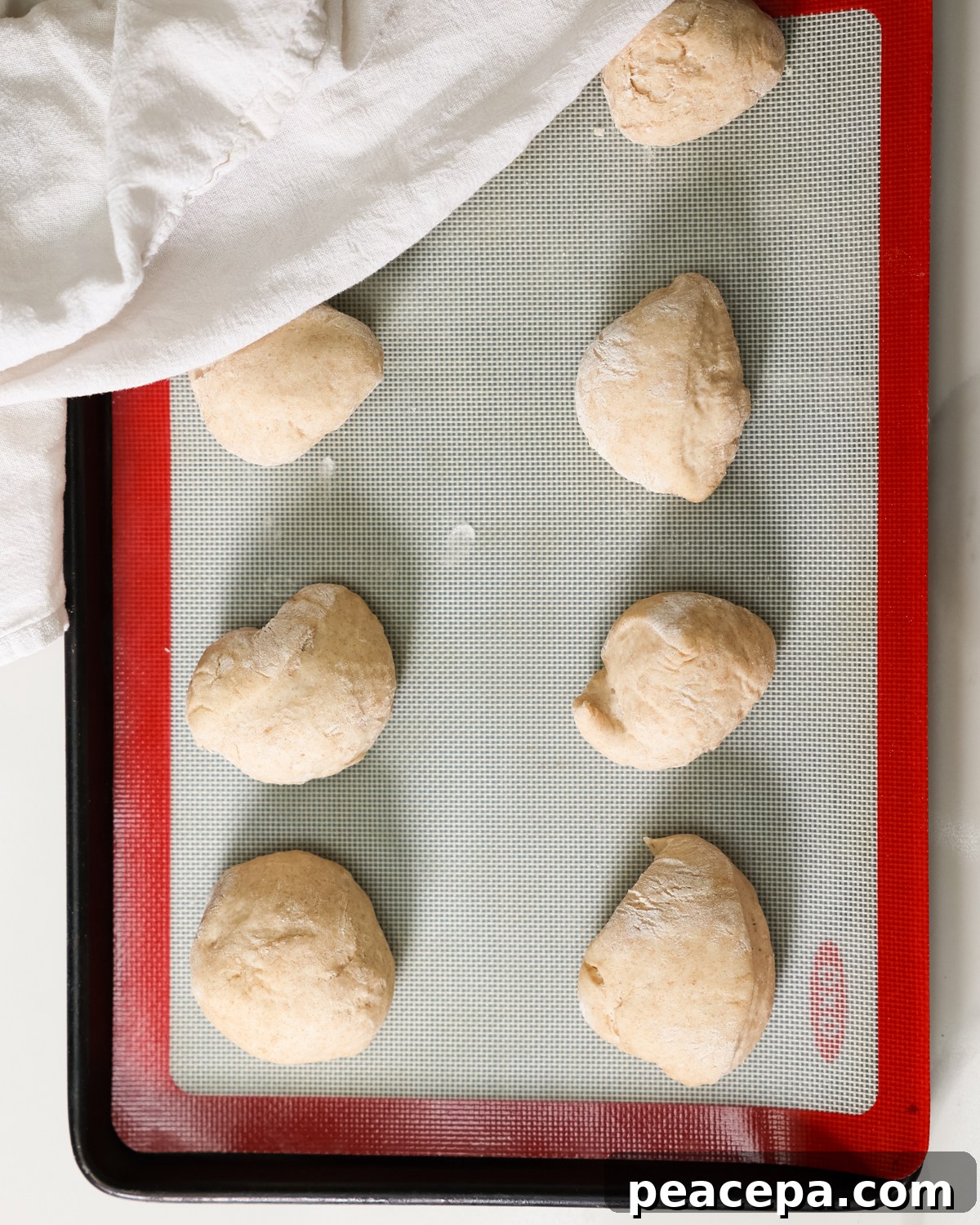 naan balls on baking sheet