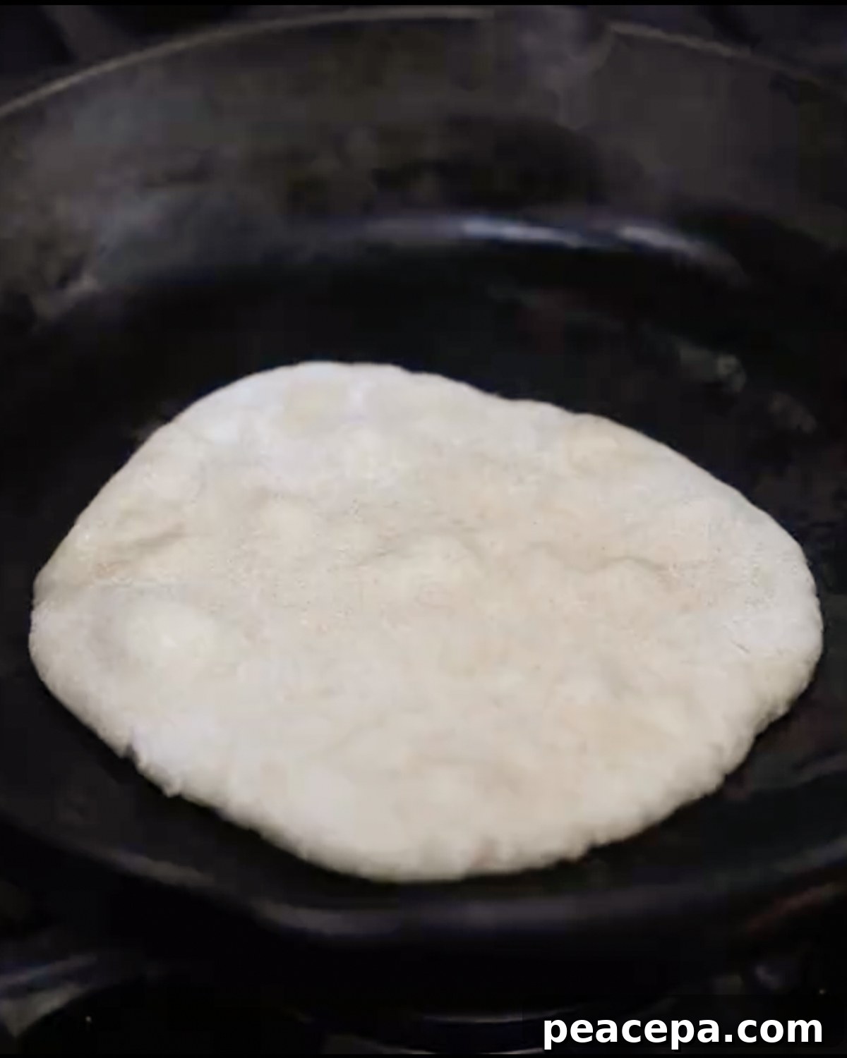 naan bubbling on skillet