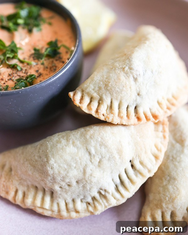 three quarter angle view of vegan empanadas on a plate