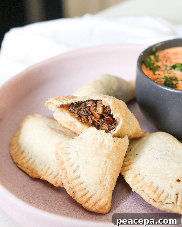 three quarter view of the inside of a mushroom vegan empanada`