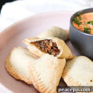 three quarter view of the inside of a mushroom vegan empanada`