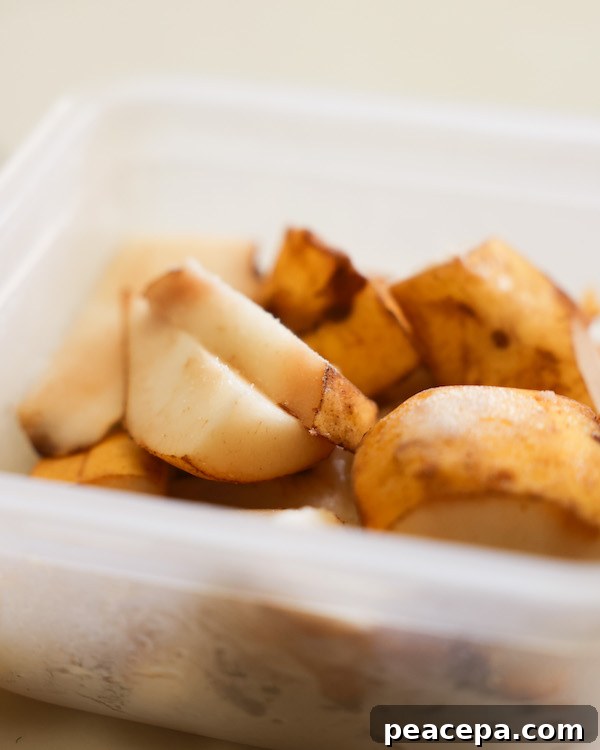 frozen overripe pears in a plastic container