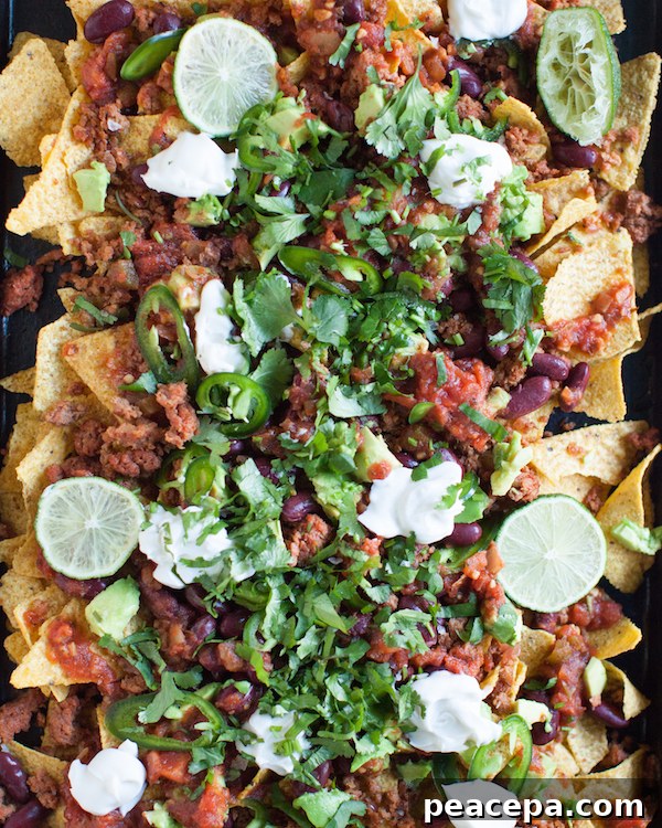 overhead of vegan nachos served on a baking sheet