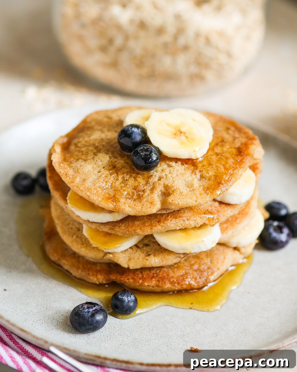 Oat flour pancakes with bananas and blueberries.