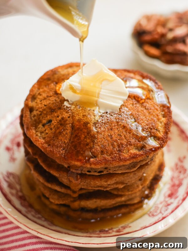 vegan sweet potato pancakes topped with maple syrup