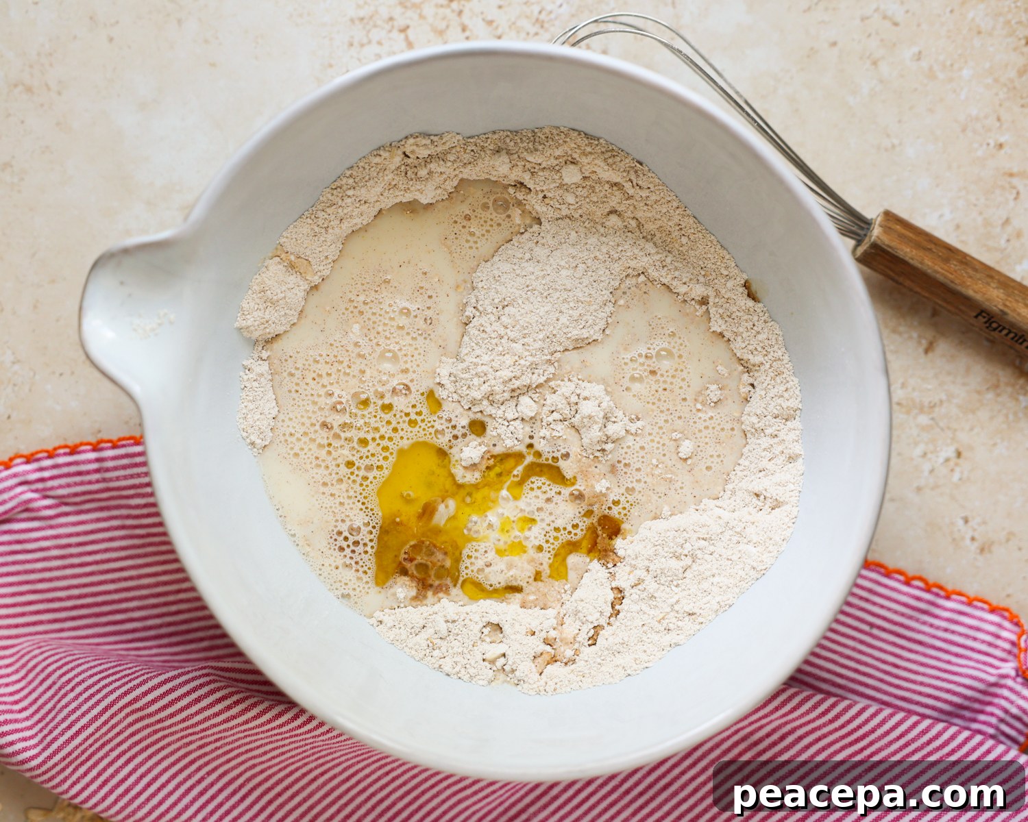 Wet pancake ingredients added to the mixing bowl.