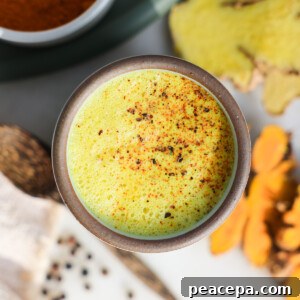 Turmeric latte, golden milk, in a mug.