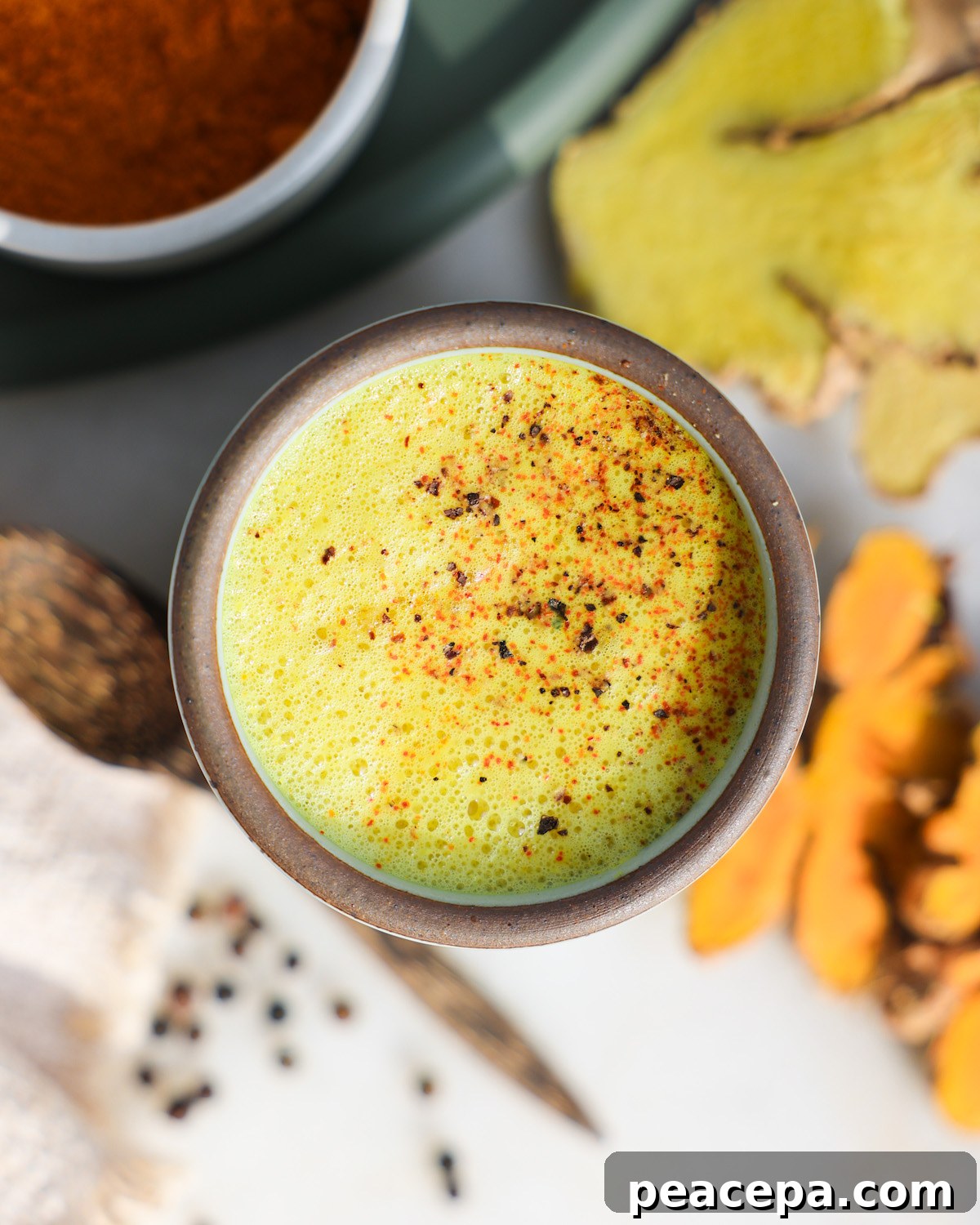 Turmeric latte, golden milk, in a mug.