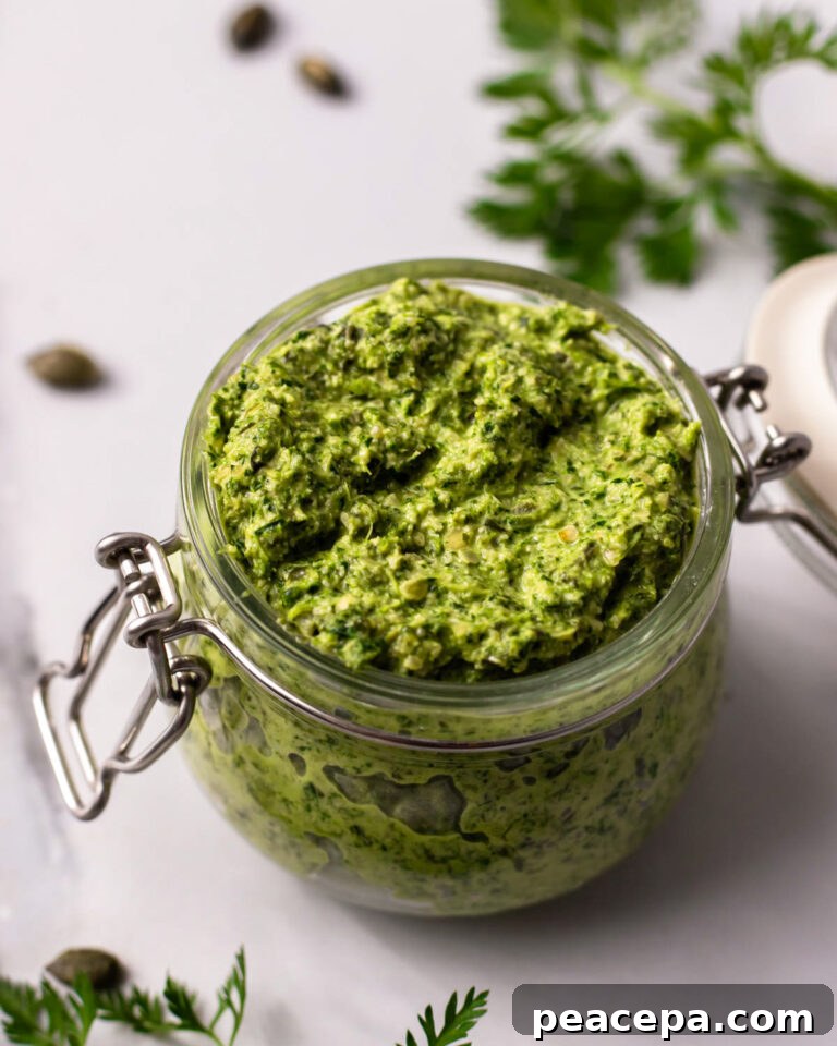 carrot top pesto in a glass jar