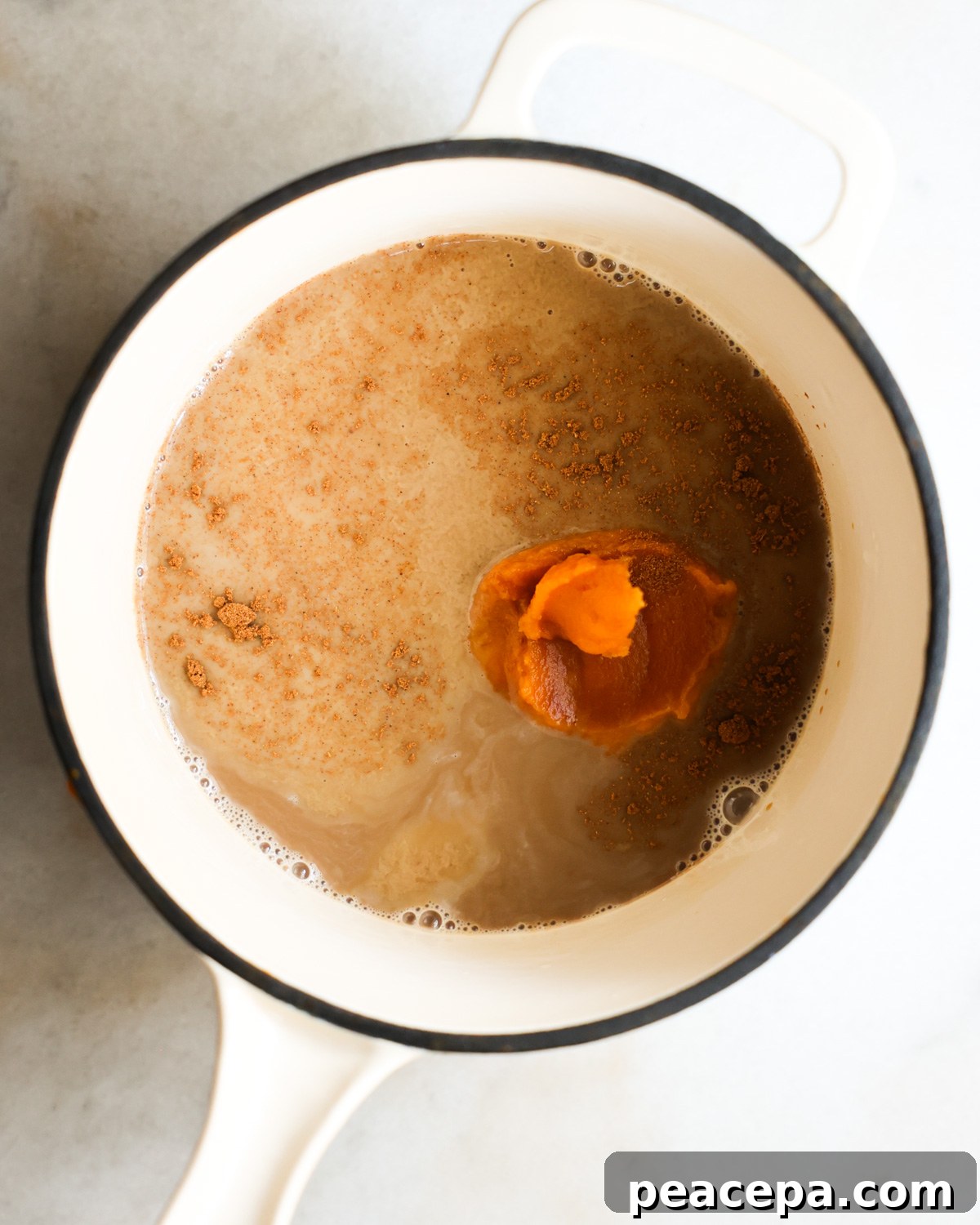 overhead of ingredients for sweet potato latte in a saucepan