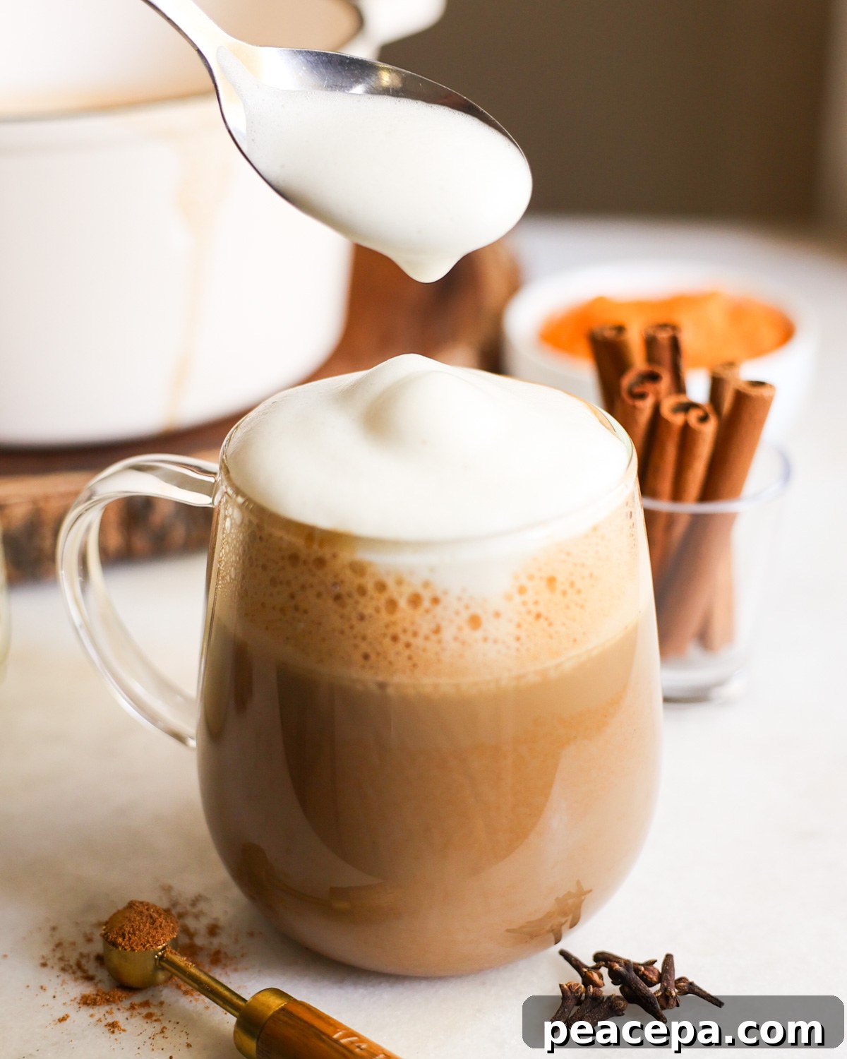topping the latte with milk foam