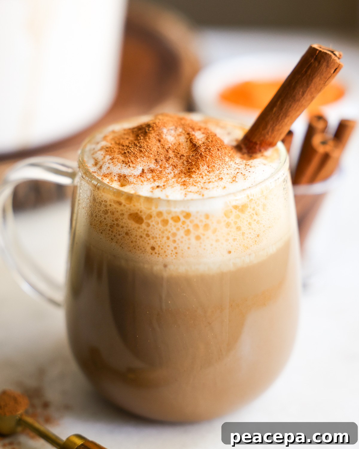 latte in a clear glass mug