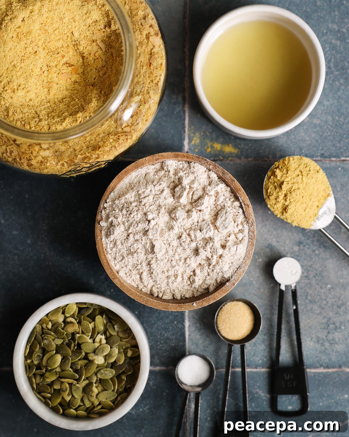 All of the ingredients for "cheesy" pumpkin seed crackers on the counter.