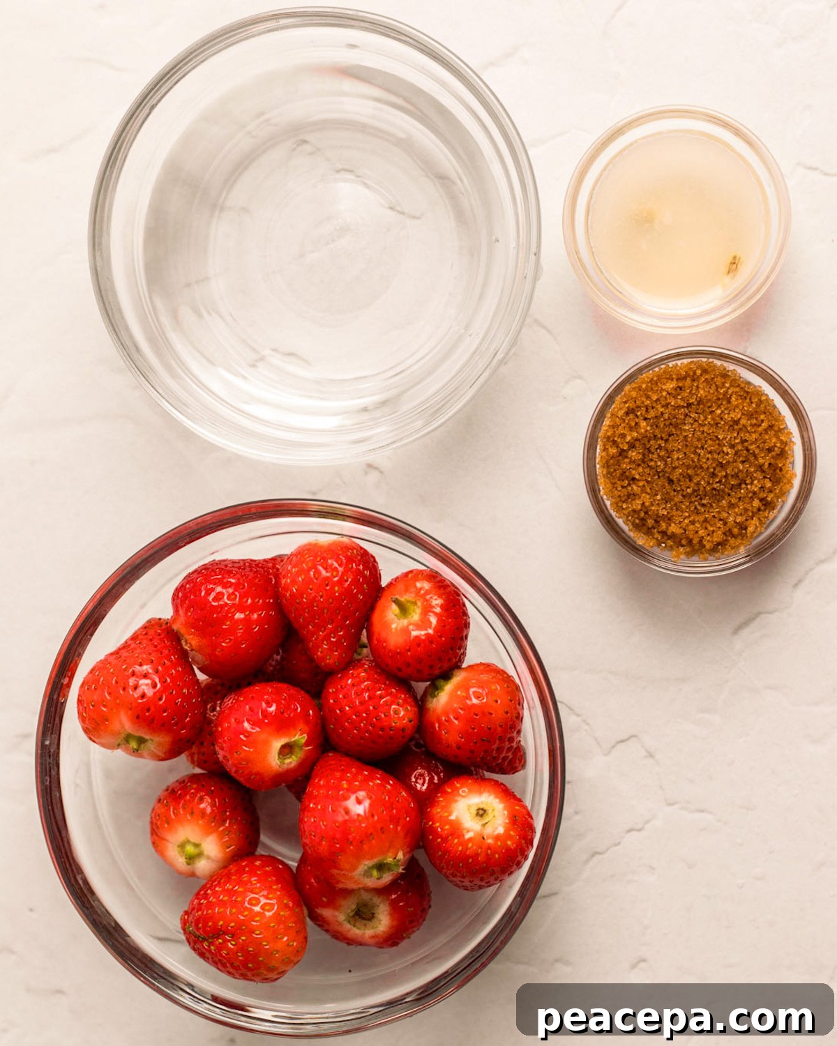 All of the ingredients for strawberry soda on the counter.