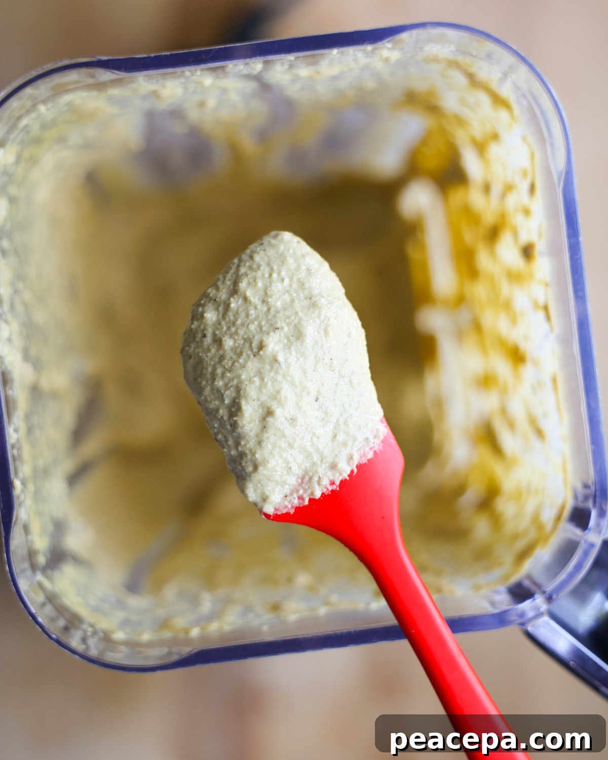 creamy vegan caesar dressing ingredients on a spatula