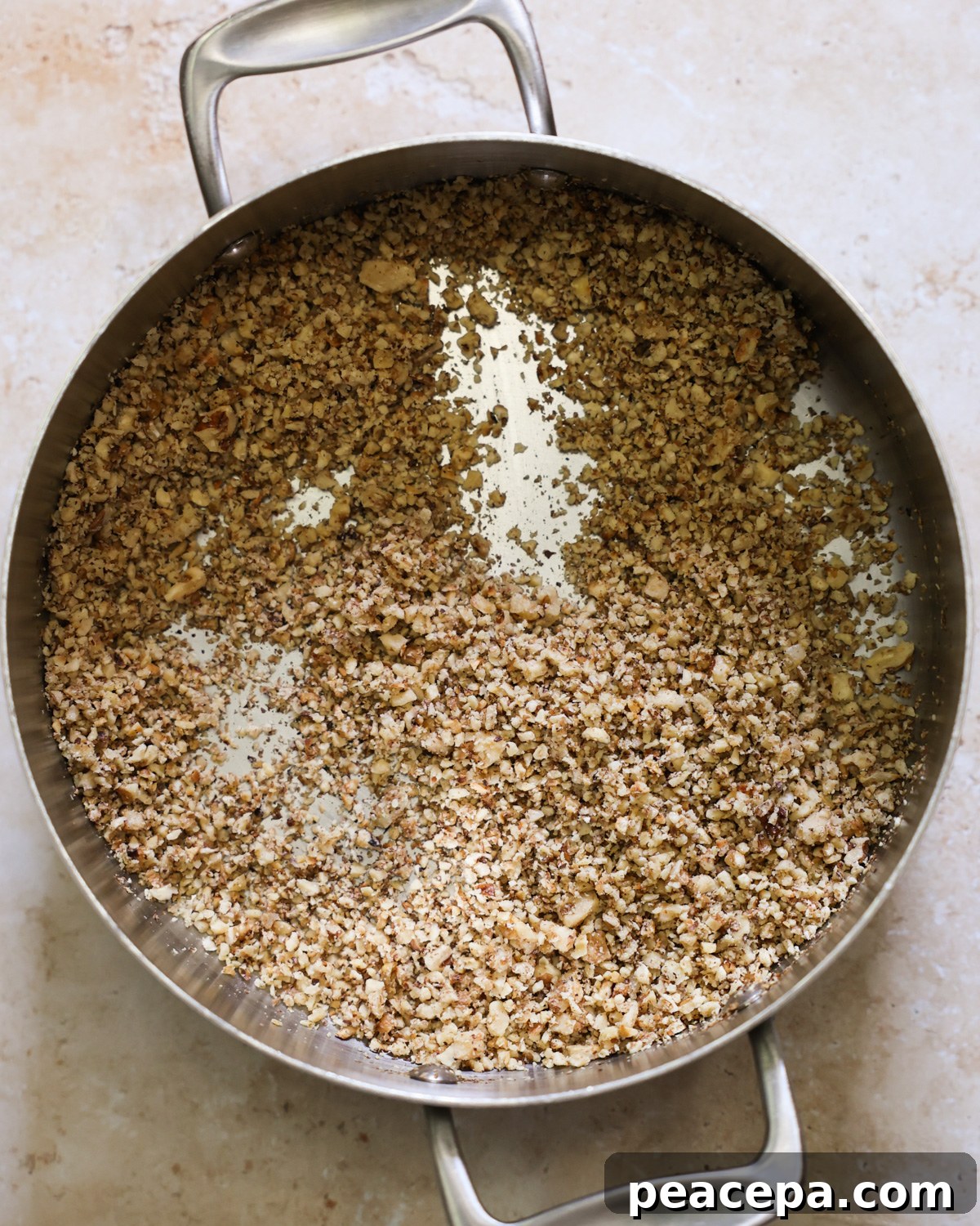 walnuts toasting in a pan