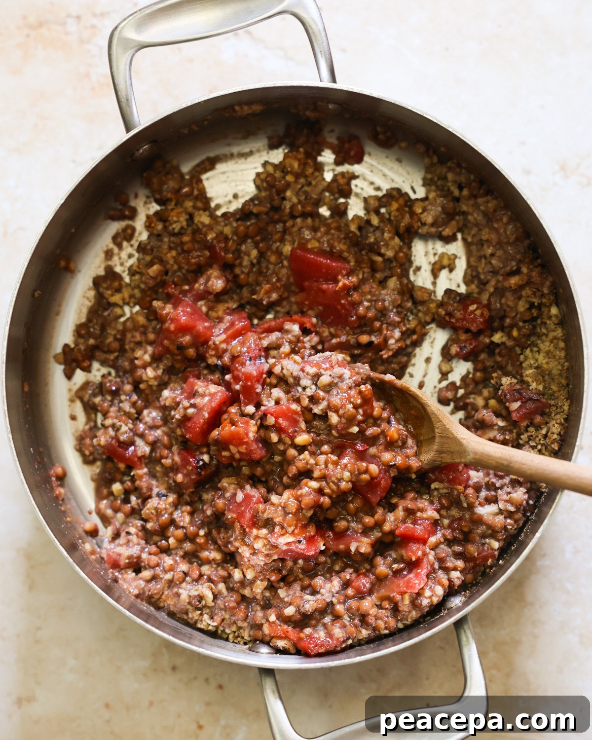 overhead of lentil taco meat cooking in pan