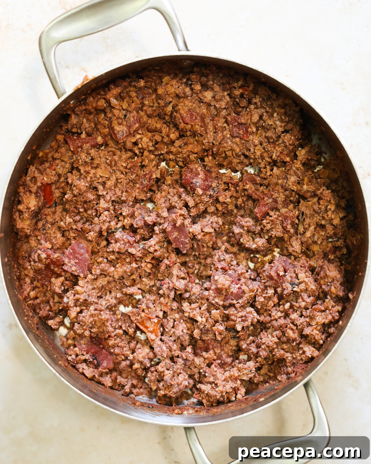 overhead of cooked walnut lentil taco meat in pan