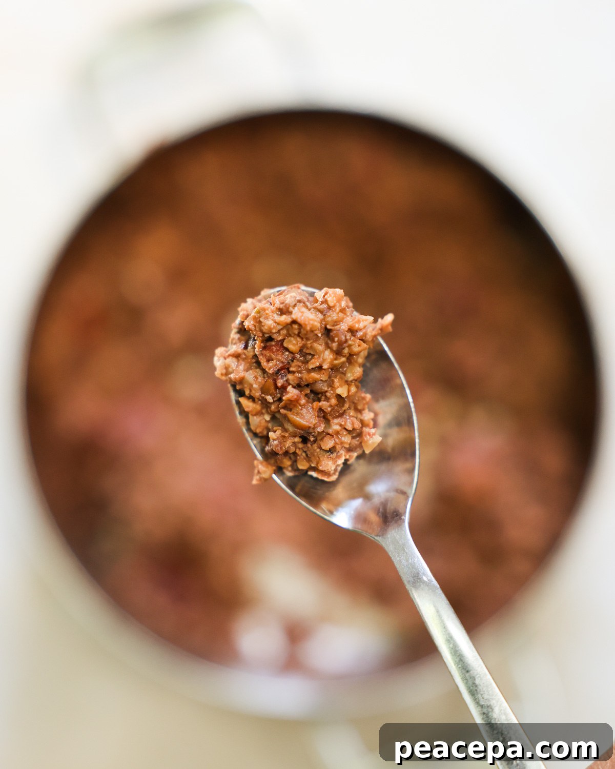 closeup of lentil taco meat on a spoon