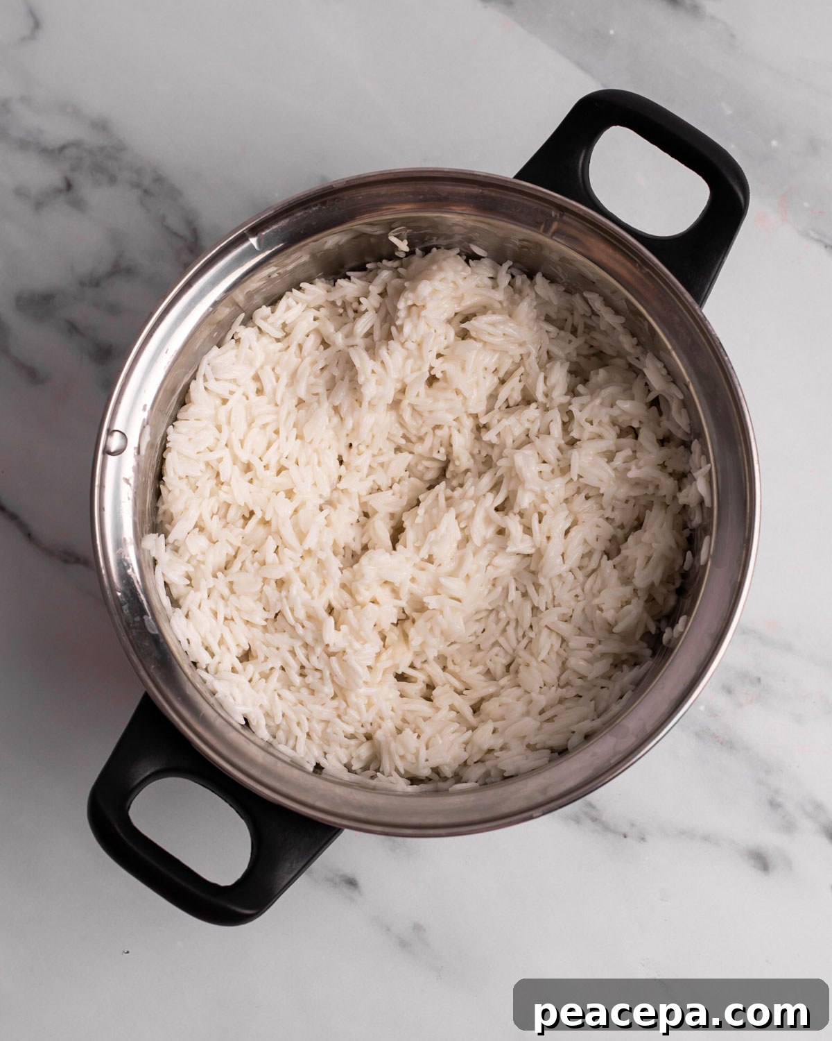 overhead of cooked coconut jasmine rice in a pot