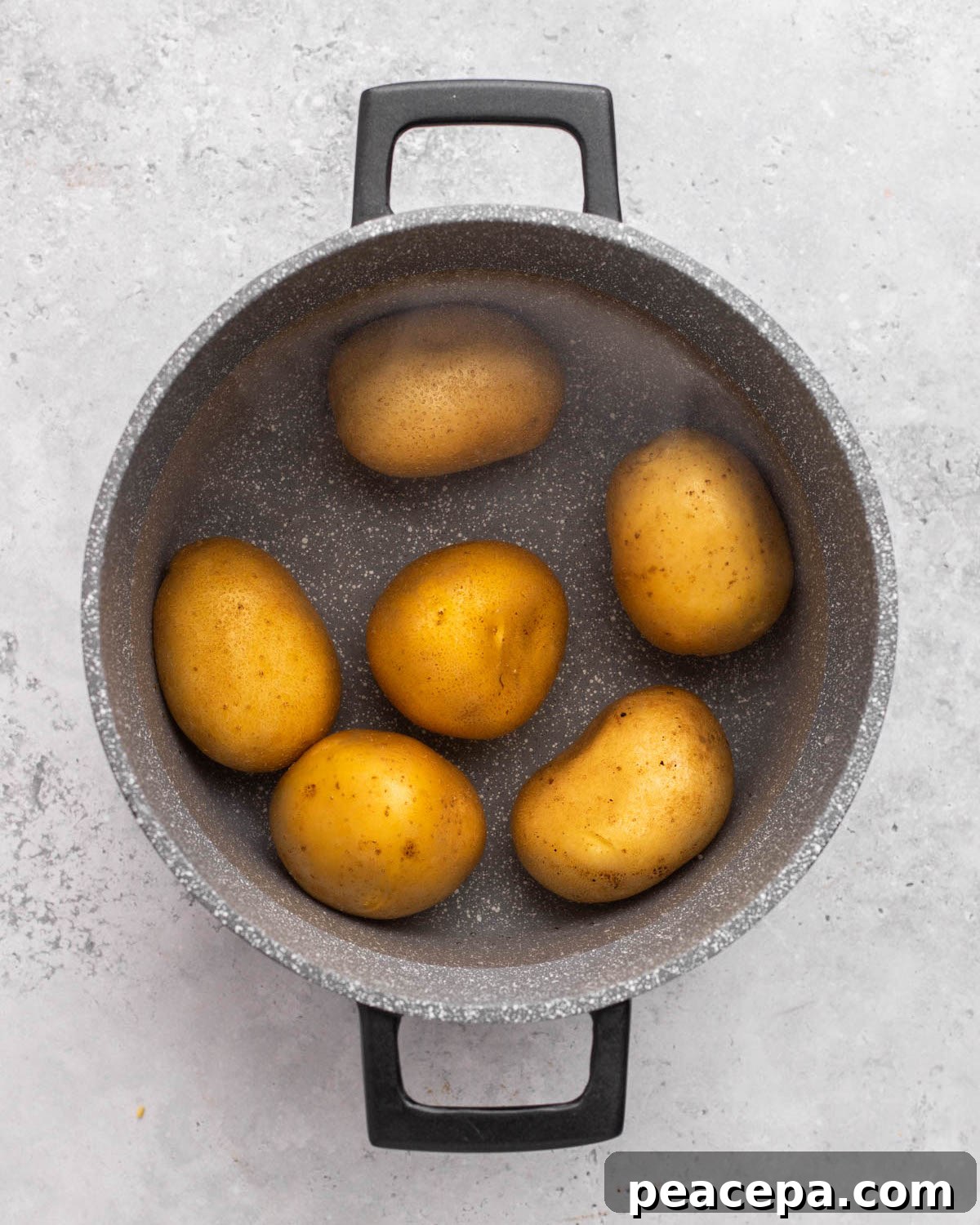 over head of potatoes boiling in pot