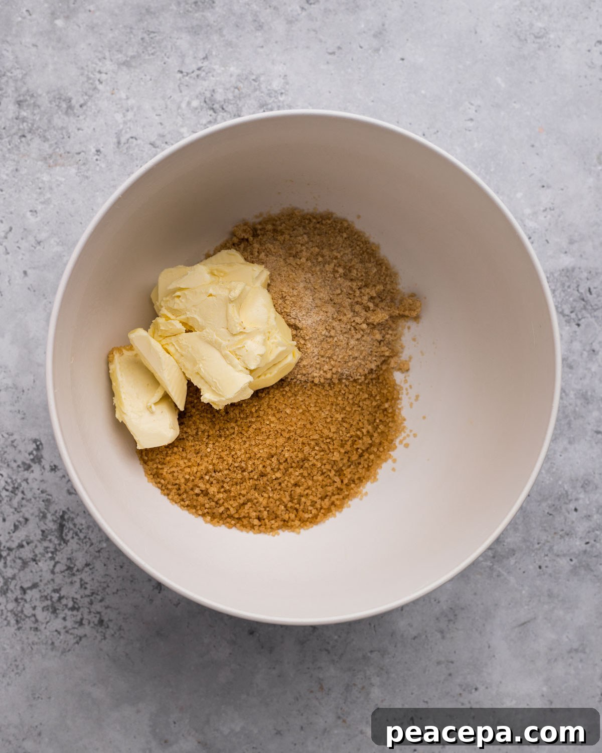 Overhead of sugar and vegan butter for Vegan Oatmeal Chocolate Chip Cookies