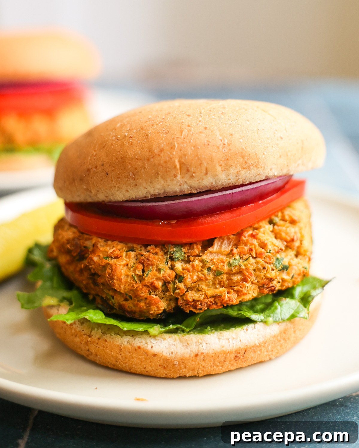 side view of zucchini burger on a bun