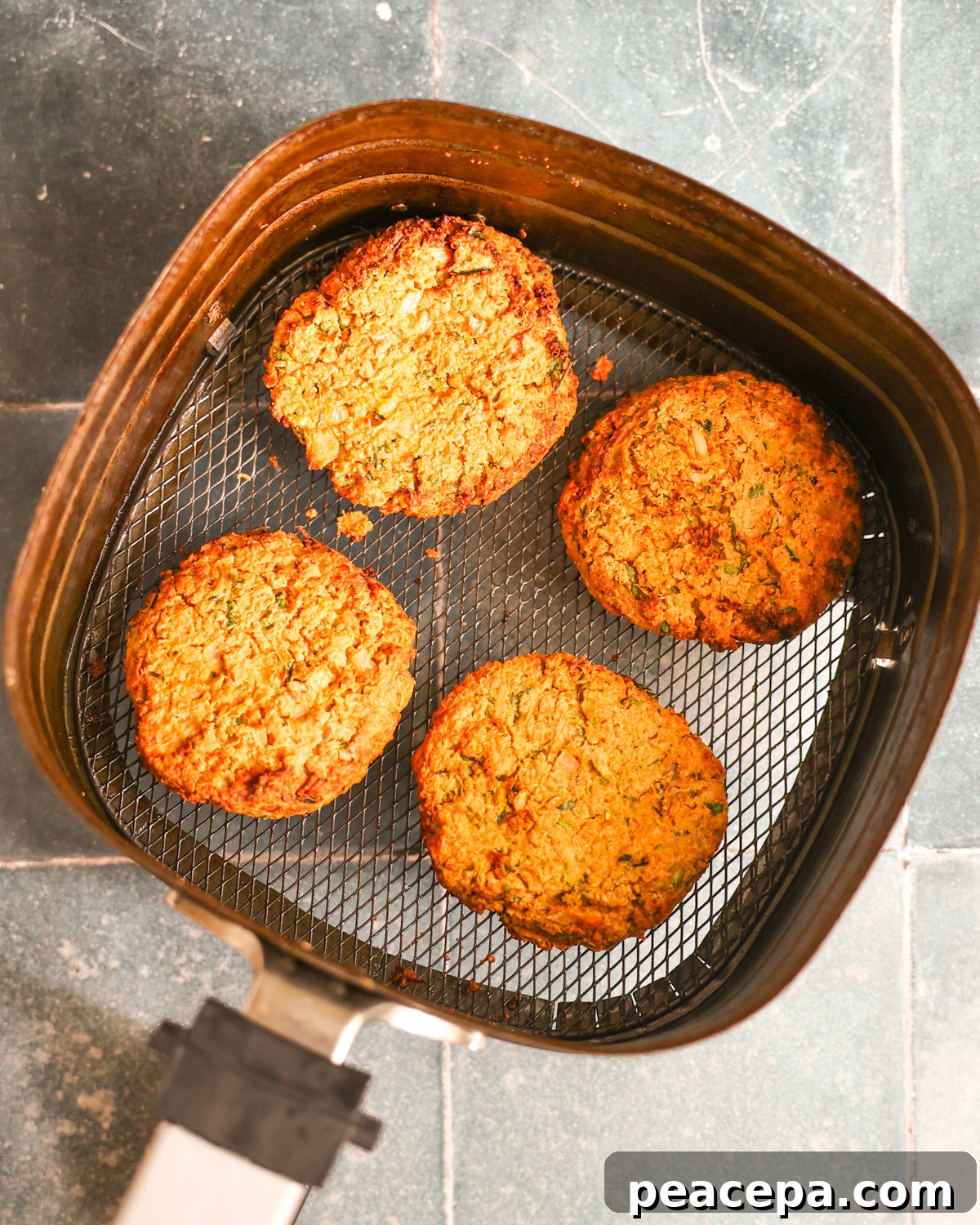 overhead of zucchini burgers cooked in air fryer