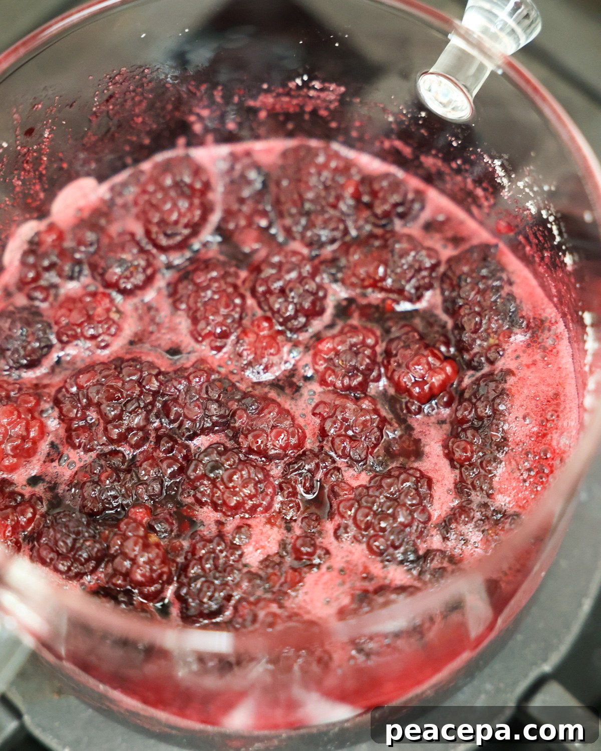 closeup of blackberry syrup on stove