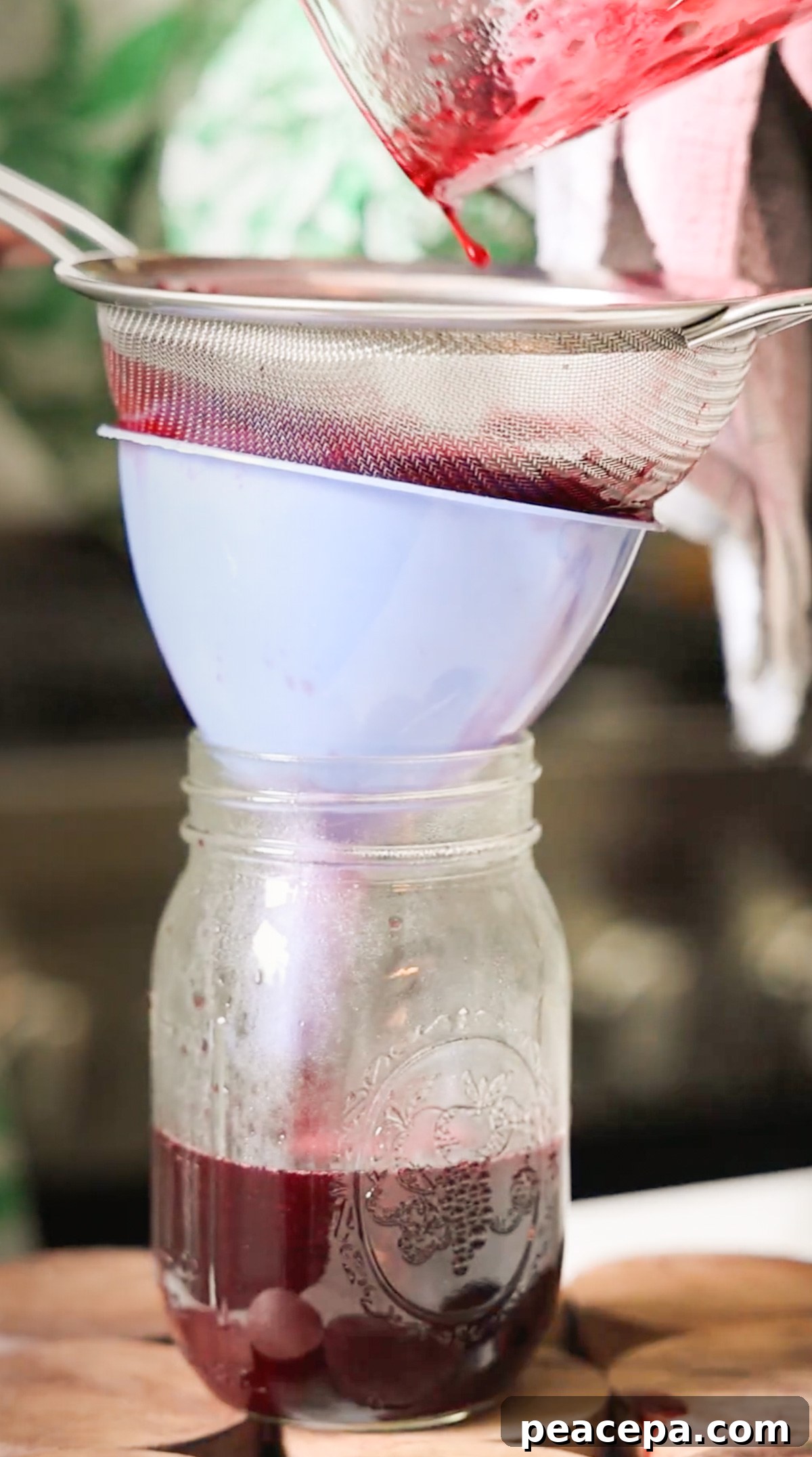straining solids out of blackberry syrup