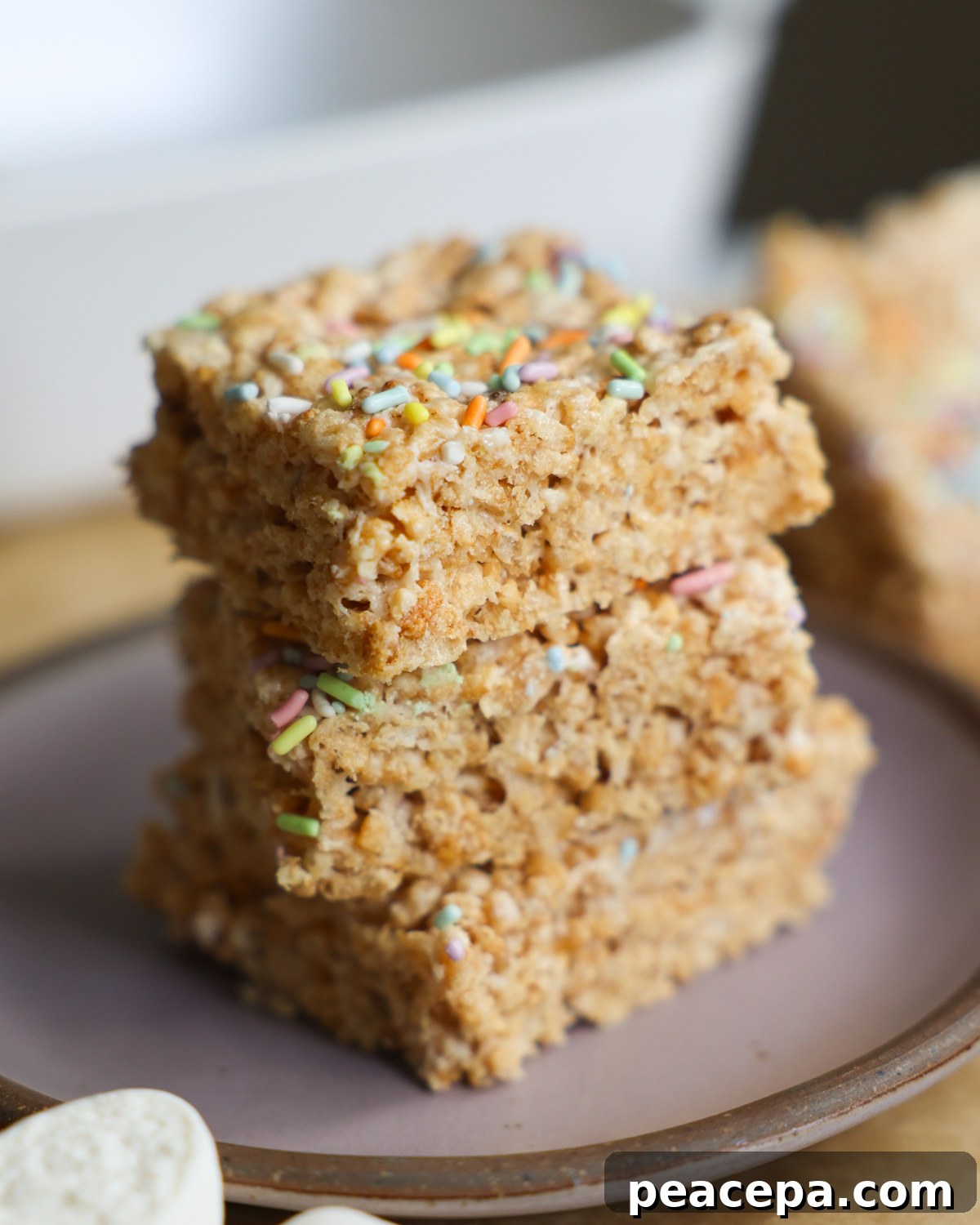 vegan rice crispy treats stacked on a plate