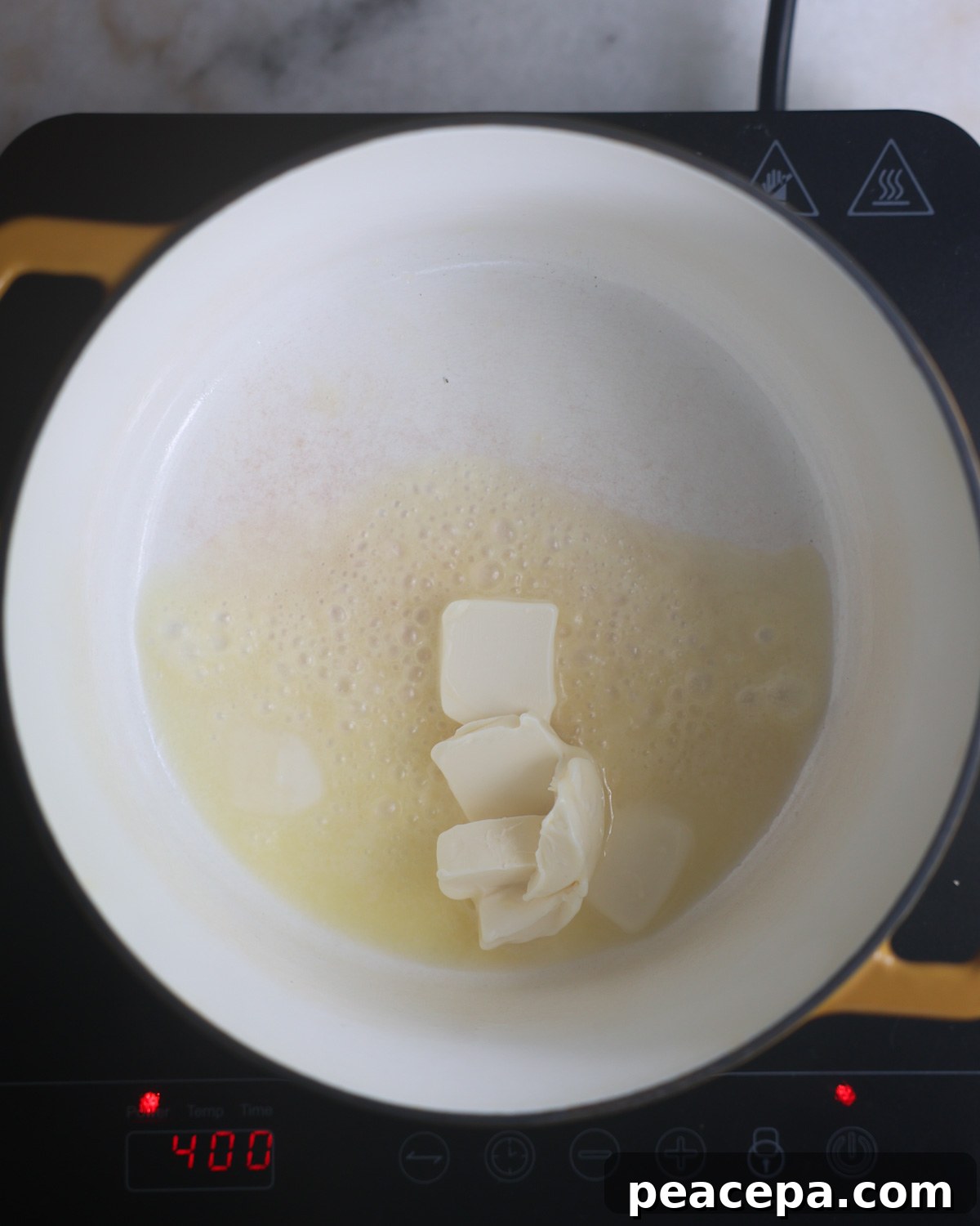 overhead of vegan butter melting in a pot