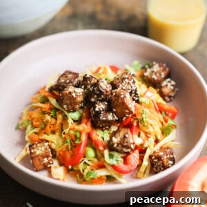 An angled overhead shot of a bowl of Crunchy Sesame Tofu Salad.