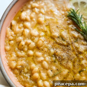 Creamy instant pot white beans in a bowl.