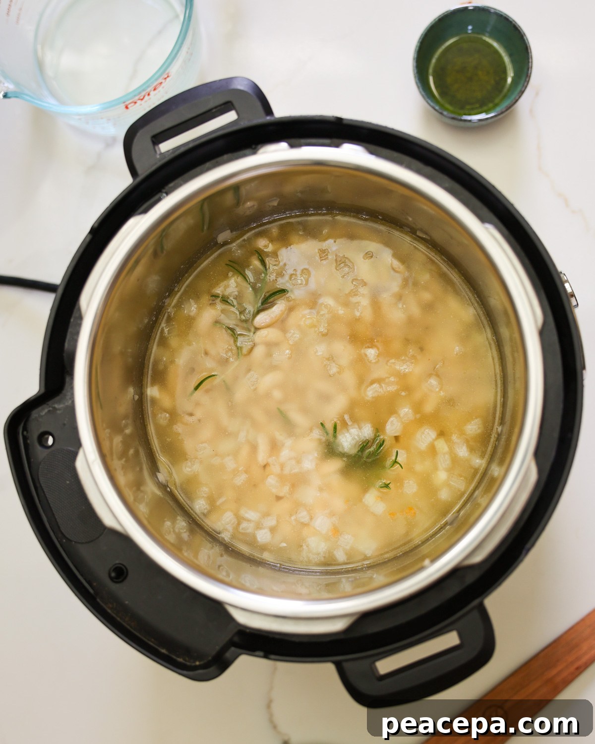 Beans and water added to the Instant Pot.