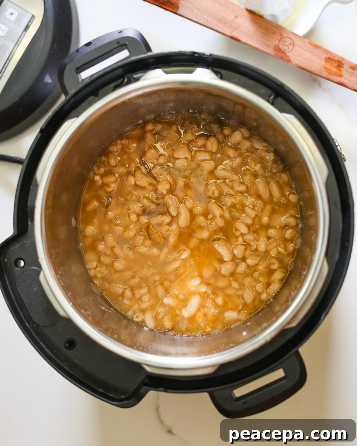 Cooked creamy white beans in the Instant Pot.
