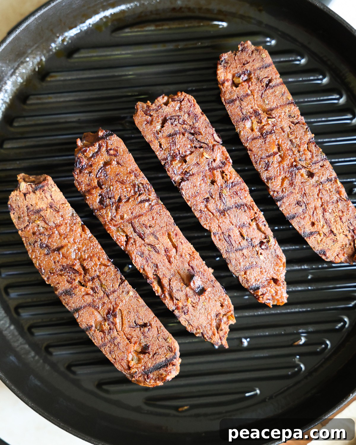 Vega sausages on a grill pan.