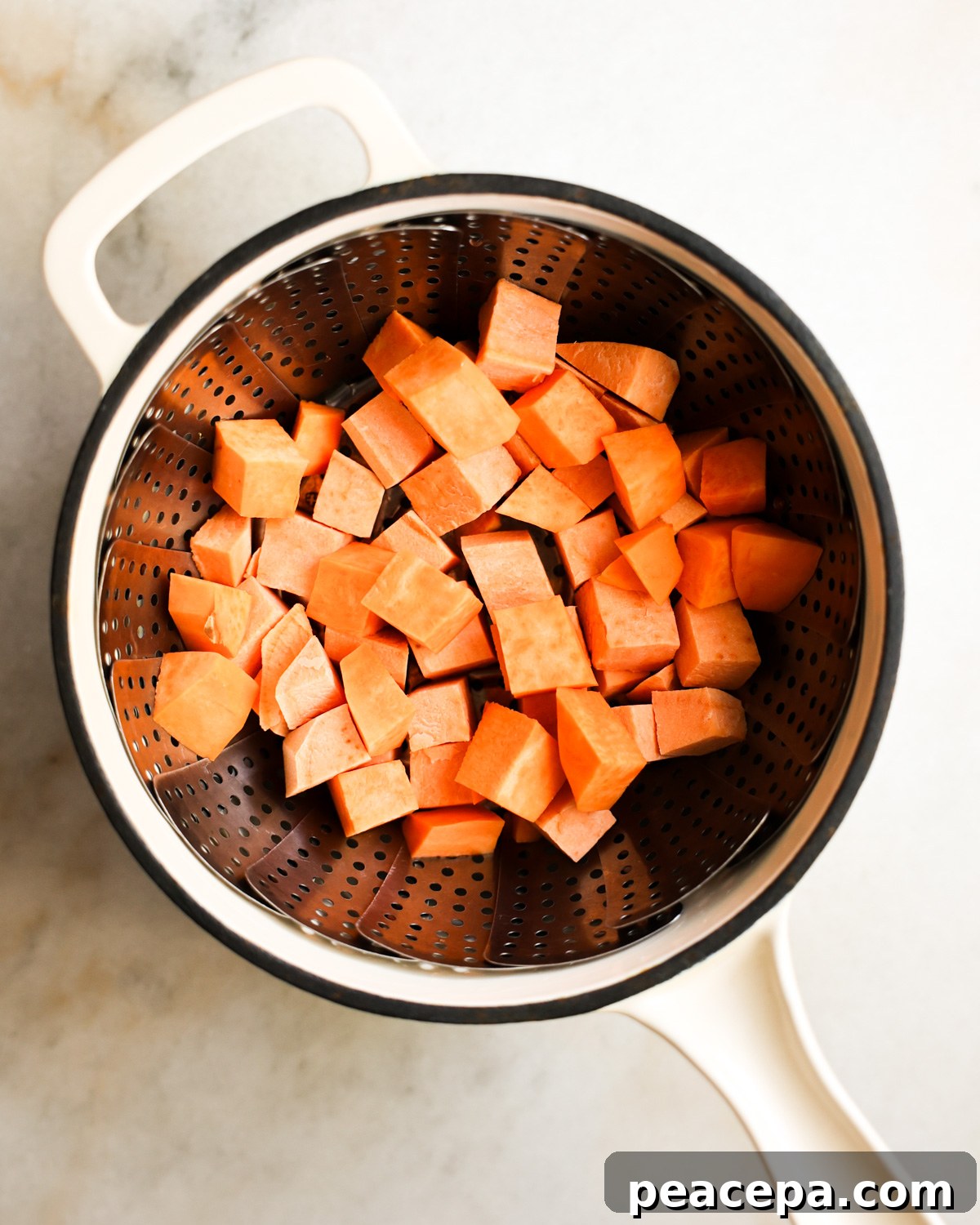 overhead of sweet potatoes in a steam basket